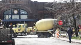Photos: Crews pave sidewalks in front of Westclox in Peru
