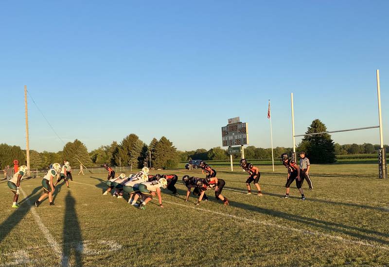 The Flanagan-Cornell/Woodland defense (at right) lines up against St. Thomas More's offensive unit Friday, Sept. 1, 2023, at Woodland School in rural Streator.