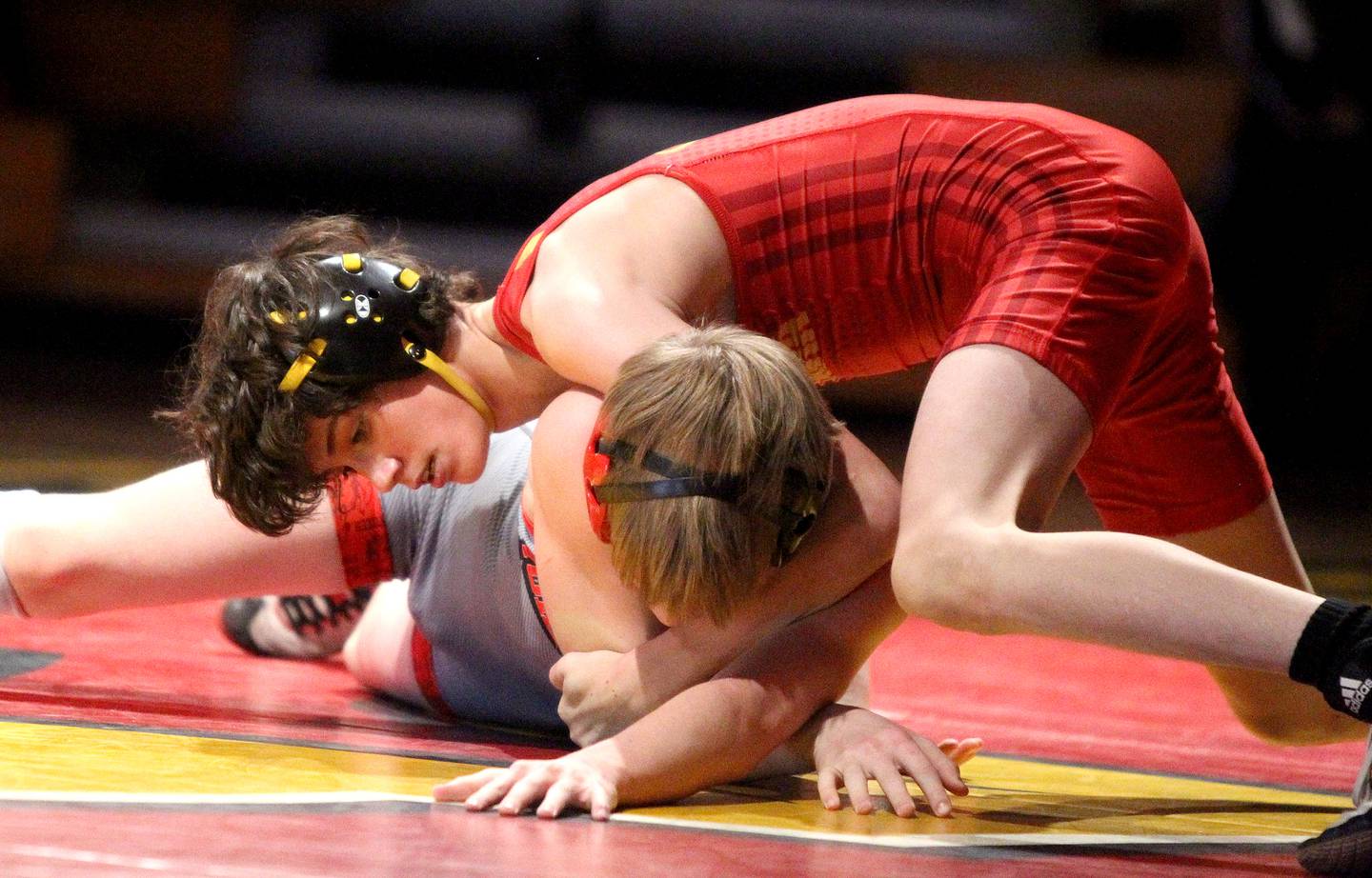 Batavia's Ino Garcia (top) competes against Yorkville's Jack Ferguson in the 113-pound weight class in a dual meet at Batavia on Wednesday, Jan. 26, 2022.