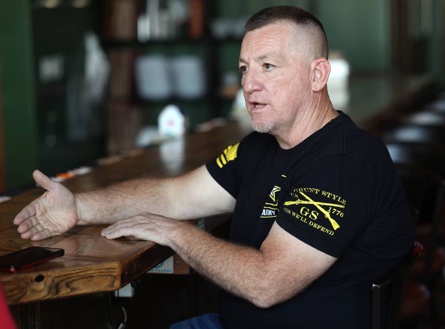 Mike Crawford, U.S. Army veteran and owner of Hobnobbers Food & Spirits in Sycamore, talks Monday, Sept. 22, 2025, at the restaraunt, about how wrestling and the Army influenced the person he is today.
