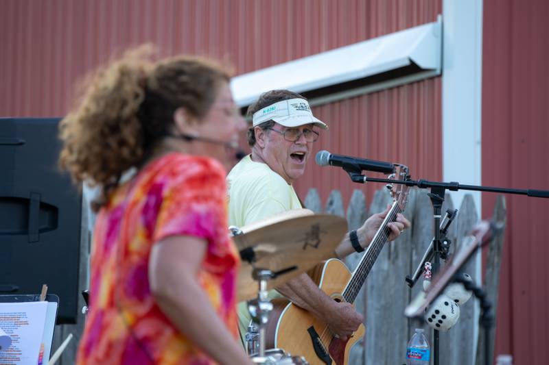 Audry (left) and Greg (right) of the Unscheduled Tour band perform at Wiltse Farm's Sunflower Fest in Maple Park on Thursday, July 21, 2022.