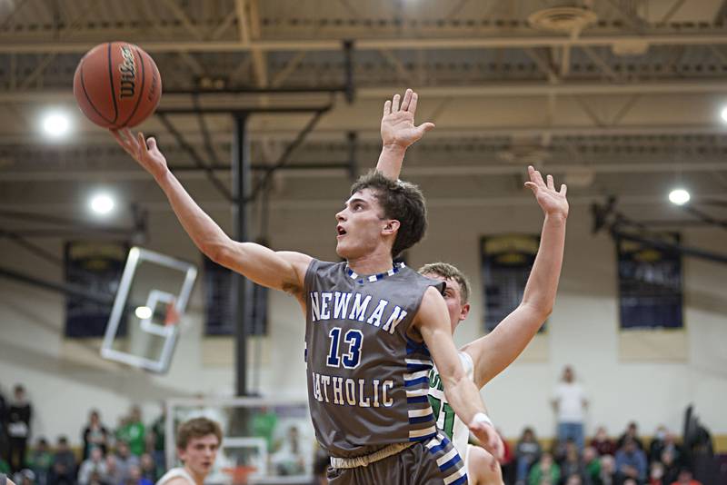 Newman's Nolan Britt puts up a shot against Scales Mound in the sectional final Friday, March 4, 2022.
