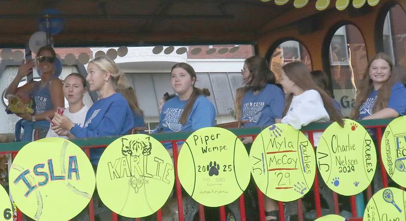 The Princeton High School girls tennis team rides during the homecoming parade on Thursday, Sept. 25, 2025 along South Main Street in Princeton .