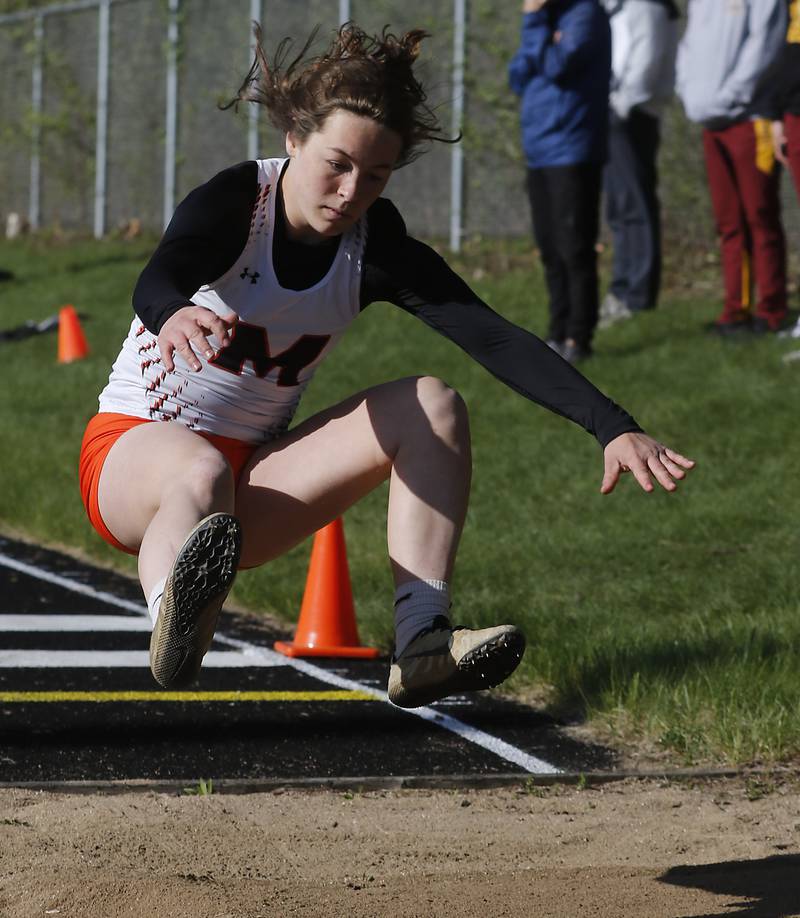 McHenry’s Gabi Grasser competes in the long jump on Friday, April 19, 2024, during the McHenry County Track and Field Meet at Cary-Grove High School.