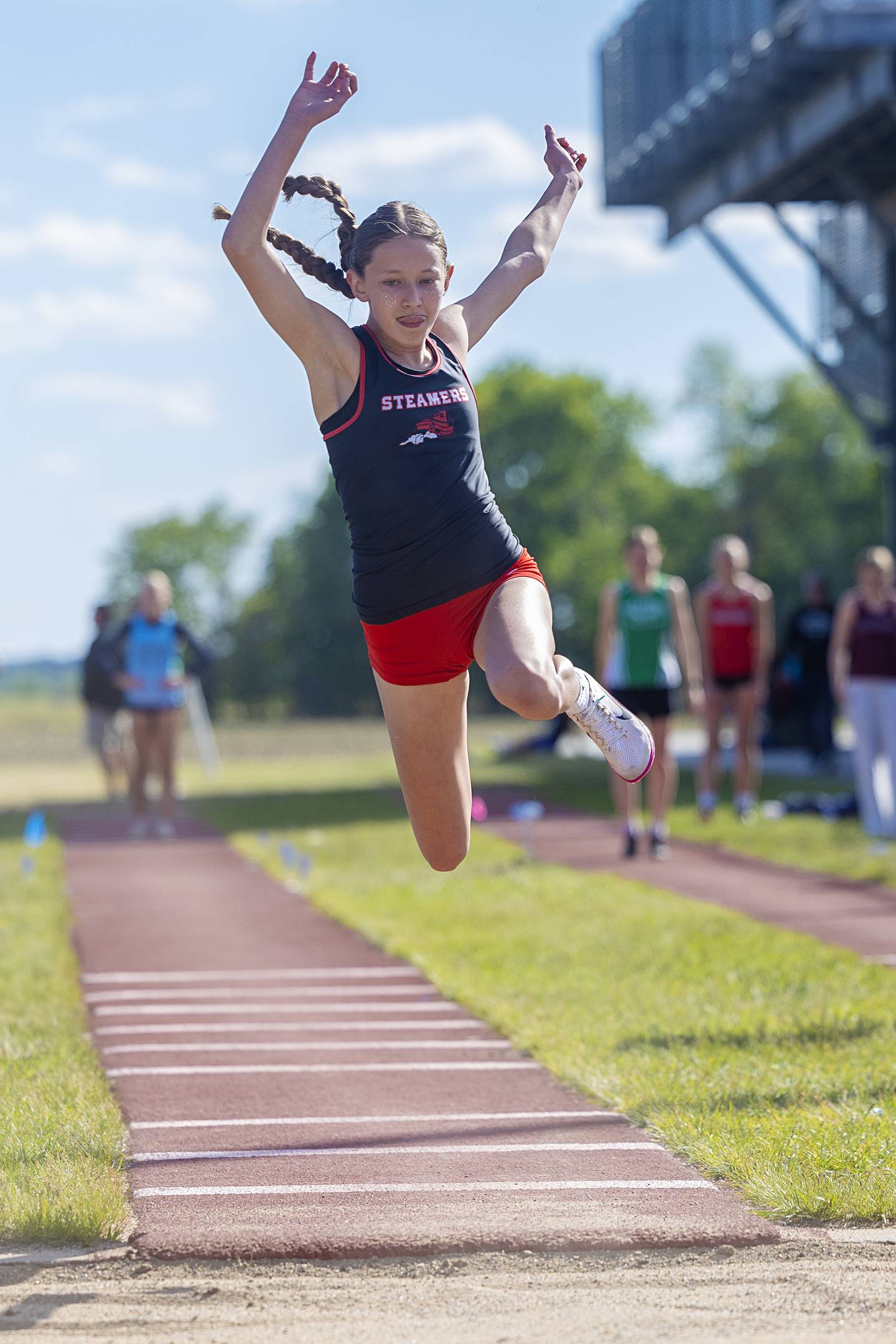 Fulton’s Paisley VanZuiden takes off in the triple jump Wednesday, May 13, 2026, during the Class 1A Erie Sectional meet.