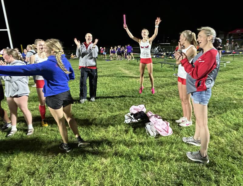 Oregon track and field team members and their coaches celebrate after winning the 1A Lena-Winslow sectional on Thursday, May 15, 2025.