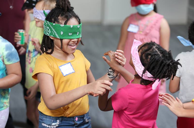 Jameya Taylor, (left) 7, from DeKalb, finds her sister Janae, 4, during an activity about the noises heard on a farm Monday, July 11, 2022, during of a session of Summer Reading Vacation put on by Neighbors' House in DeKalb in conjunction with the DeKalb County Farm Bureau. Christ Community Church is hosting the camp this week in their outreach center on North 6th Street in DeKalb.