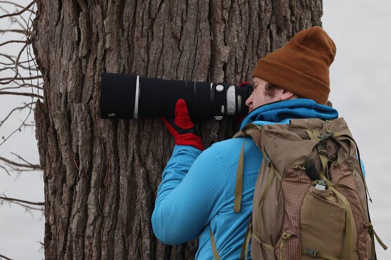 Nature photography hobbyist Keith Olson, of Elmhurst, takes a photo of an eagle spotted along the Des Plaines River at the Four Rivers Environmental Education Center’s annual Eagle Watch program in Channahon.
