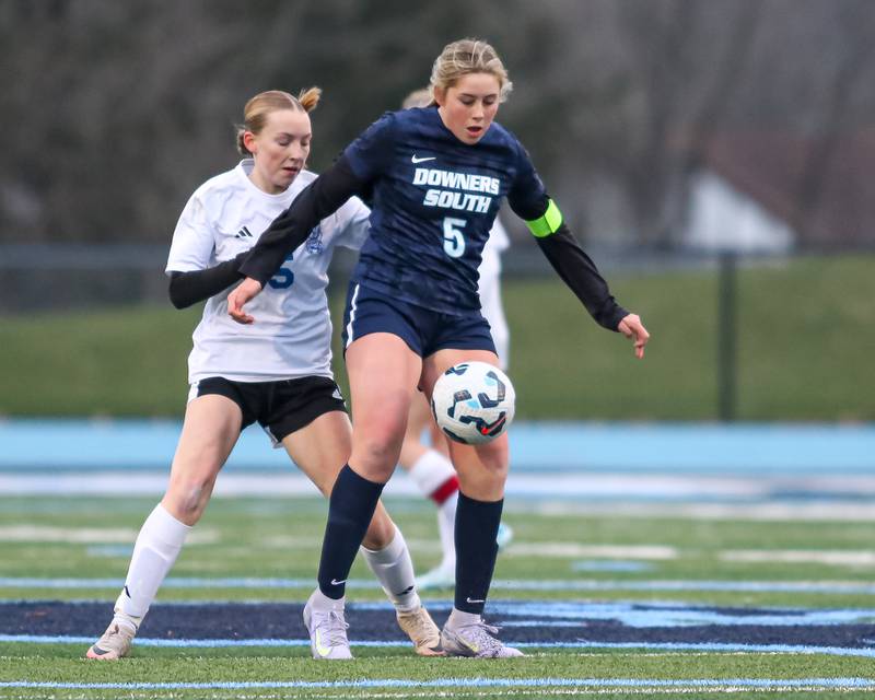 Downers Grove South's Sienna Thurston (5) blocks off the defense during soccer match between Riverside-Brookfield at Downers Grove South.  April 10, 2025.