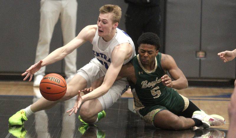 Burlington Central’s Drew Scharnowski, left, races Rockford Boylan’s J’Mar Johnson for the ball in IHSA Class 3A Sectional action at Burlington Central High School Wednesday night.