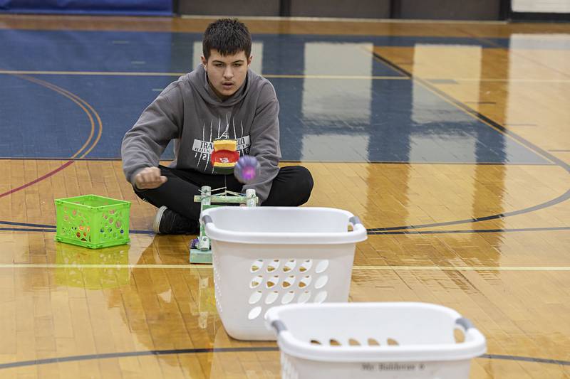 Zachary Walker, a seventh grader at Rock Falls Middle School, fires off his group's catapult Thursday, Dec. 8, 2022.