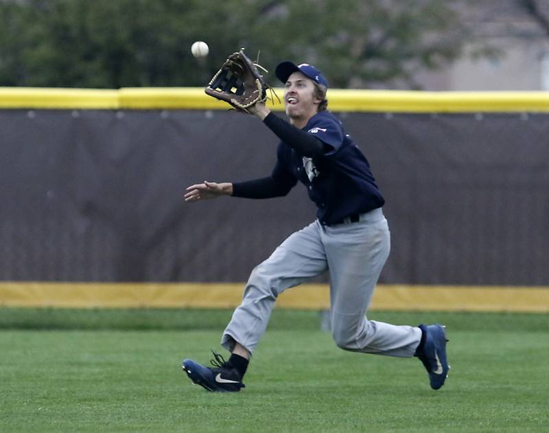 Cary-Grove’s Connor Lueck chases down a flip ball during a Fox Valley Conference baseball game Thursday, May 5, 2022,between Jacobs and Cary-Grove at Jacobs High School.