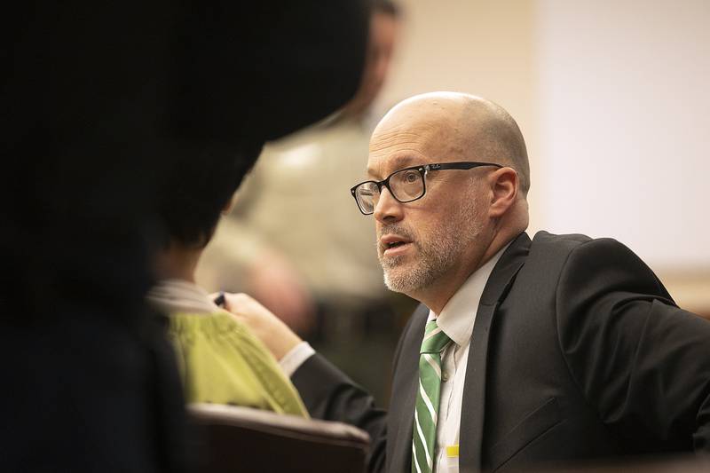 Ogle County Assistant Public Defender Michael O'Brien speaks with client Jonathon Gounaris during a hearing at the Judicial Center in Oregon on Monday, March 17, 2025.