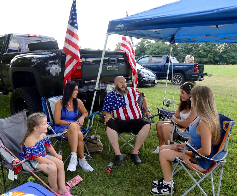 The Bates Family chats before the Elburn Lions Club’s Fireworks Show begins on Saturday, July 12, 2025 in Elburn.