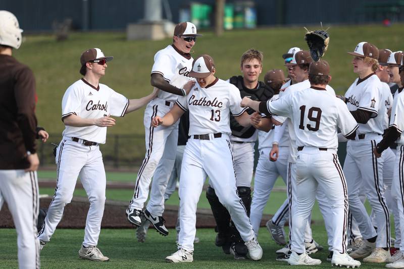 Joliet Catholic’s Zach Pamatto prevents the tying run in the bottom of the 7th by tagging out Minooka’s Hayden Host at the plate in the WJOL tournament championship on Saturday, March 30, 2024 in Joliet.