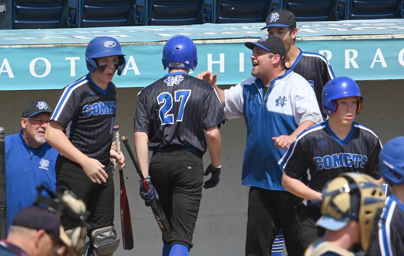 Newman celebrates as Brendan Tunink returns to the dugout after scoring the run that would end up being the only run for the Comets during the supersectional against Marquette.