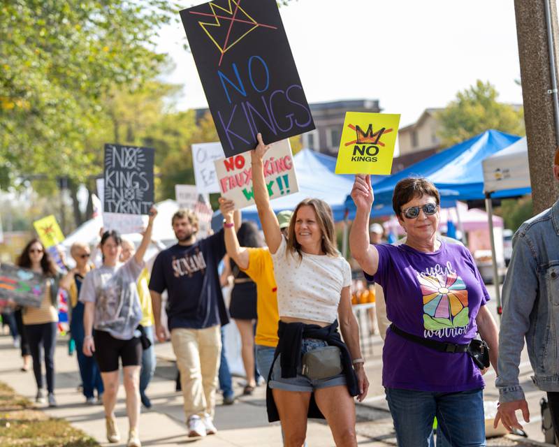 Protesters march around park at the ‘No Kings 2.0’ Protest on Saturday, October 18, 2025 at Washington Square Park in Ottawa.