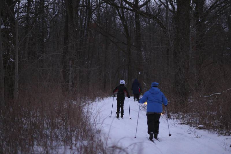 Skiers make their way down a trail on Saturday, Jan. 19, 2019, at Rush Creek Conservation Area in Harvard. The McHenry County Conservation District is hosting two more candlelight skis Friday, Feb. 15, and Saturday, Feb. 16.