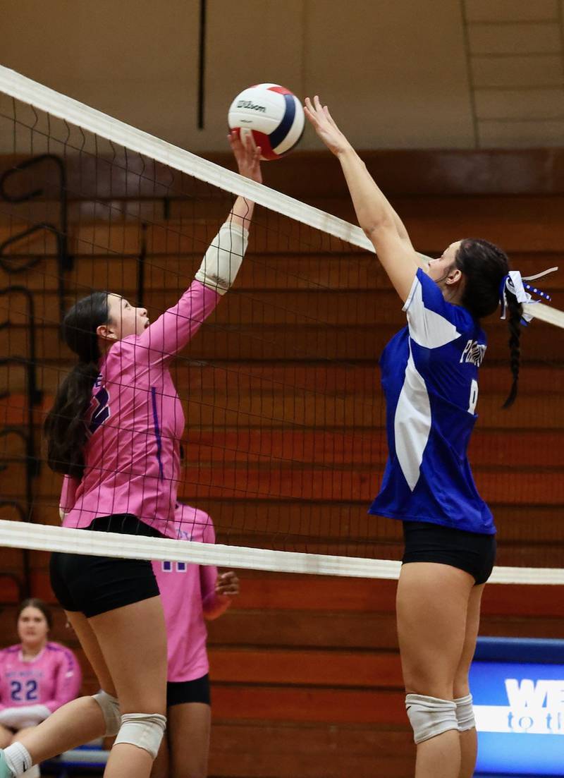 Mendota's Abby DeLao and Princeton's Keighley Davis battle at the net Tuesday night at Prouty Gym. The Tigresses won 25-15, 25-12.