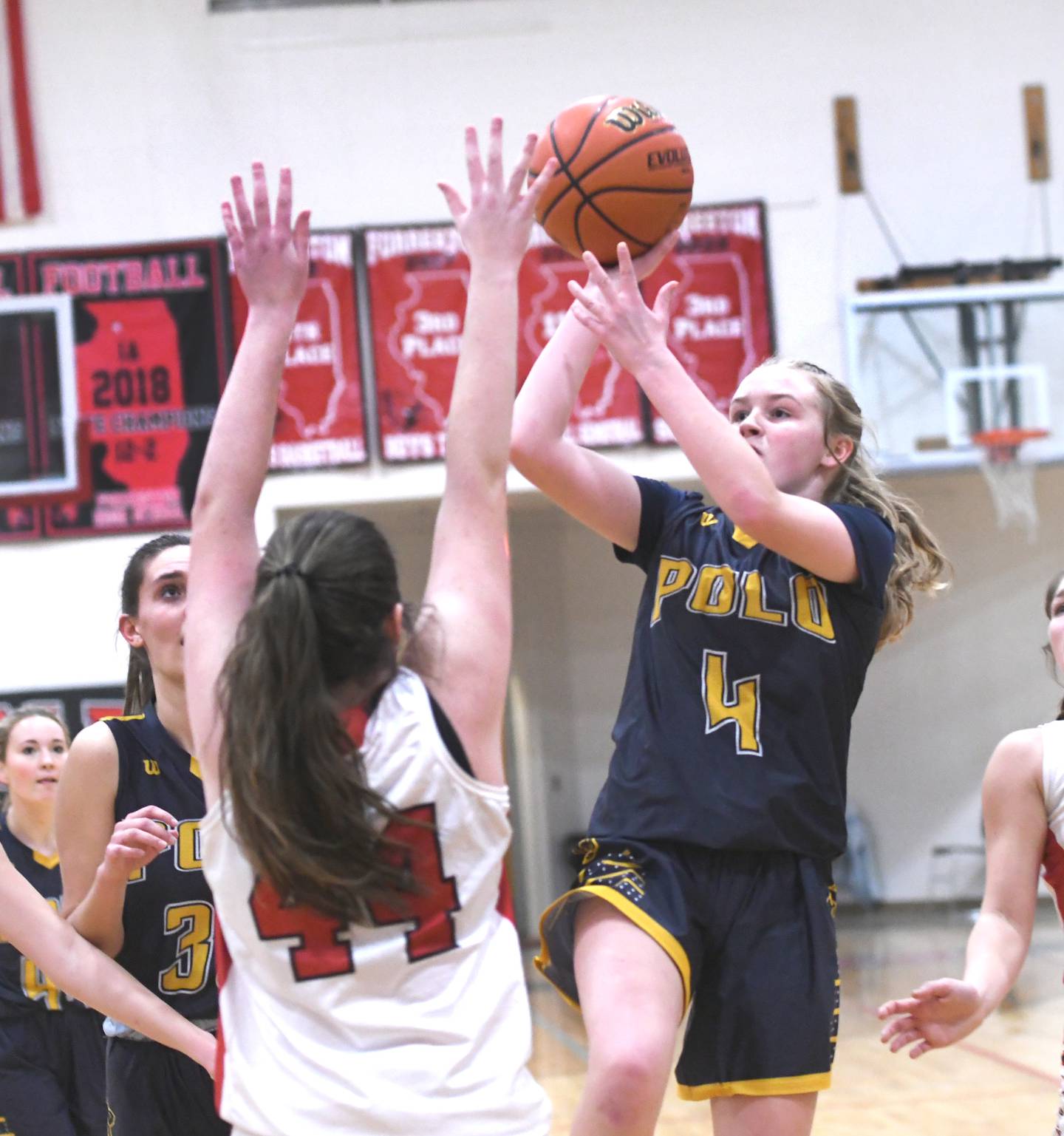 Polo's Camrynn Jones puts a shot over Forreston's Jaiden Schneiderman during Jan. 6 action in Forreston.