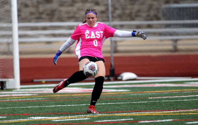 Oswego East goalkeeper Sam McPhee kicks the ball during a Naperville Invitational game against St. Charles North at Naperville Central on Saturday, April 23, 2022.