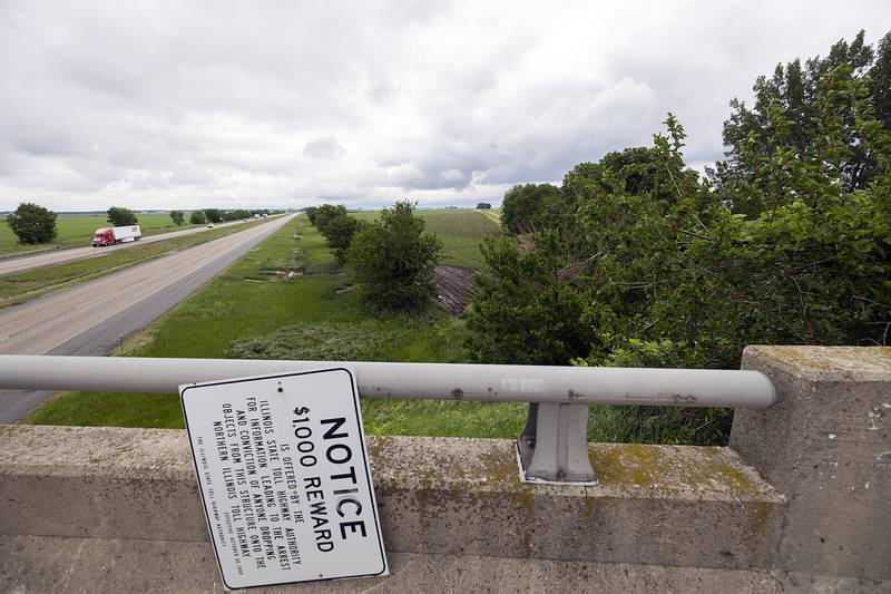 Broken tree limbs and a scorched patch of land is seen Wednesday, June 4, 2025, at the scene of the accident. Concentrated fertilizer spilled from the tanker.