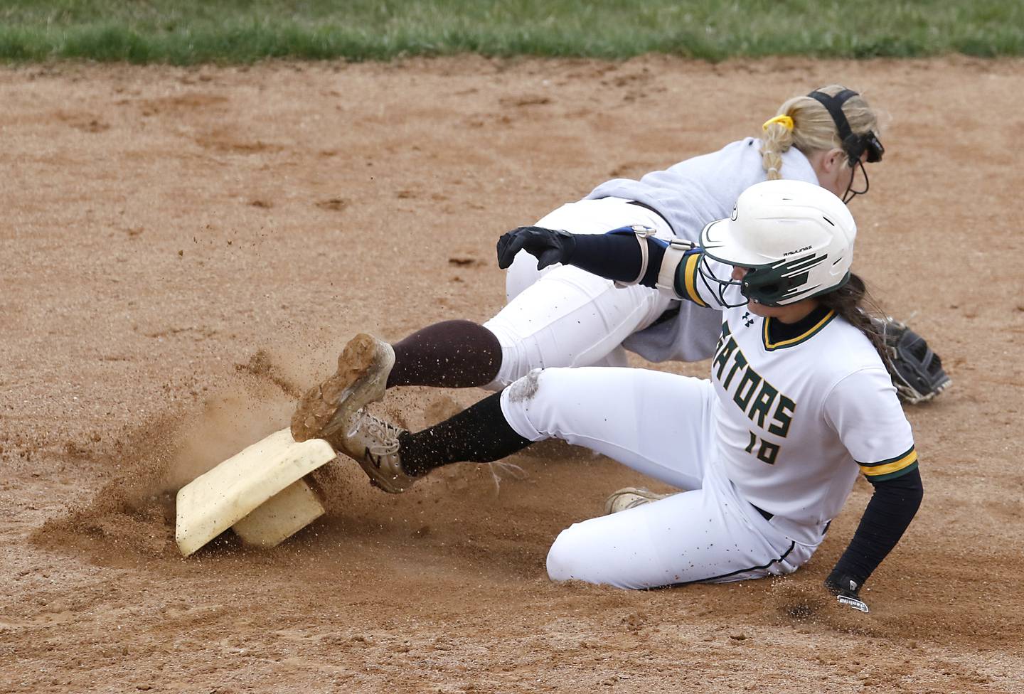 Crystal Lake South's Alexis Pupillo slides into second bas as Jacobs’s Anna Cook tries to field the ball during a Fox Valley Conference softball game Monday, April 25, 2022, between Crystal Lake South  and Jacobs at Crystal Lake South High School.