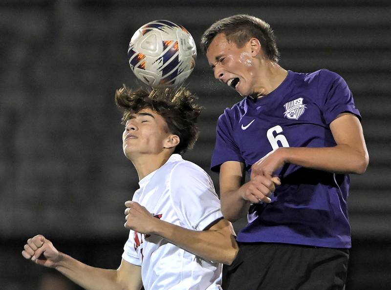 Hampshire's Grayson Hedderich, right, and Huntley's Anthony Frelas head the ball in an IHSA Class 3A boys soccer sectional semifinal game in Streamwood on Oct. 30, 2024.