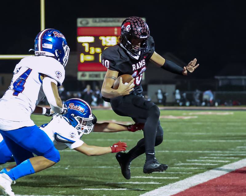 Glenbard East's Blake Salvino (10) is knocked out of bounds during football game between Glenbard South at Glenbard East.   Oct 13, 2023.