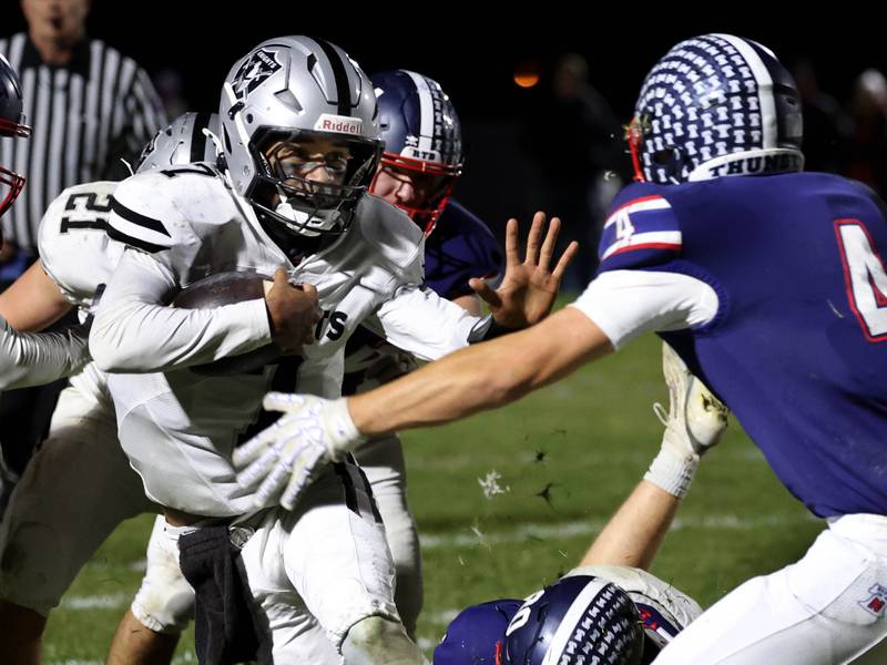 Kaneland's Jalen Carter tries to get by Belvidere North's Ben Bucher Friday, Nov. 7, 2025, during their Class 5A second round playoff game at Belvidere North High School.