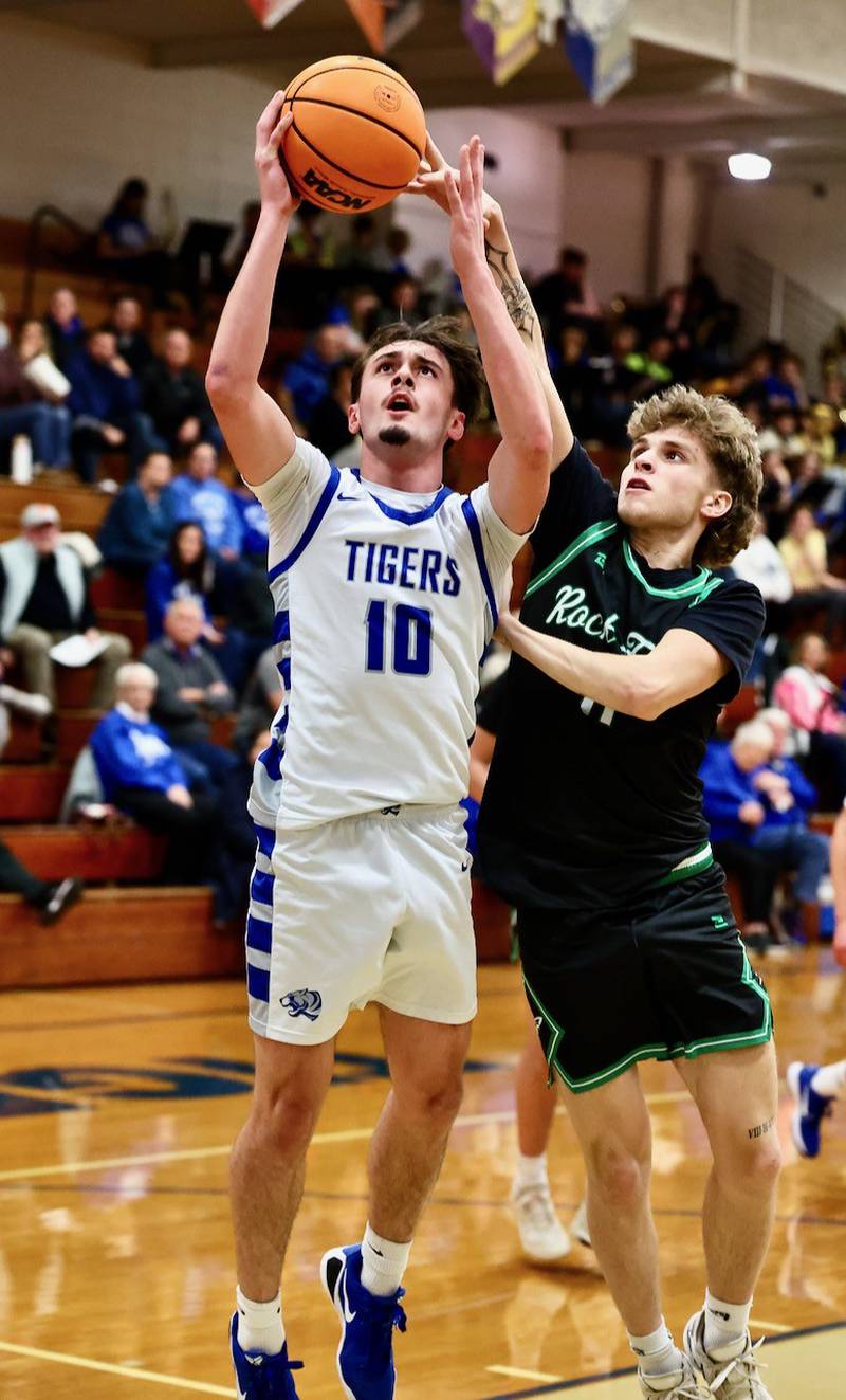 Princeton's Gavin Lanham shoots over Rock Falls' Tanner Shannon in Tuesday's game at Prouty Gym. The Rockets won 61-58.