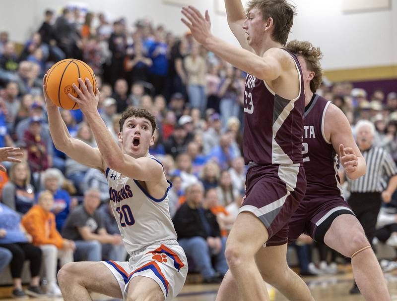 Eastland’s Zyacn Haverland works against against Dakota’s Carson Mayer (left) and Braxton Niedermeier Wednesday, March 5, 2025, during the Class 1A boys basketball Sectional semifinal at Pecatonica High School.