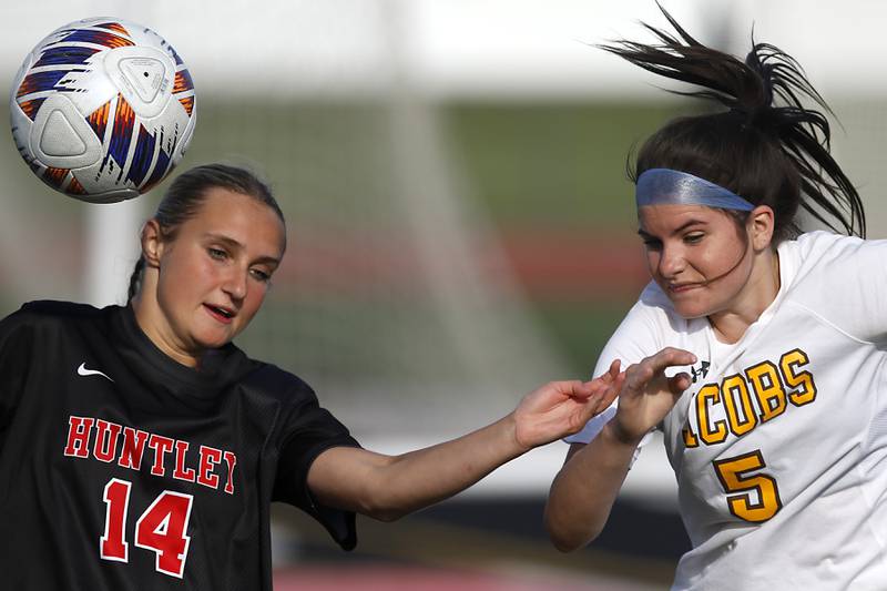Huntley's Emma Emricson battles with Jacobs' Brenna Flaskamp for the ball during the IHSA Class 3A Huntley Girls Soccer Regional championship match on Friday, May 23, 2025, at Huntley High School.