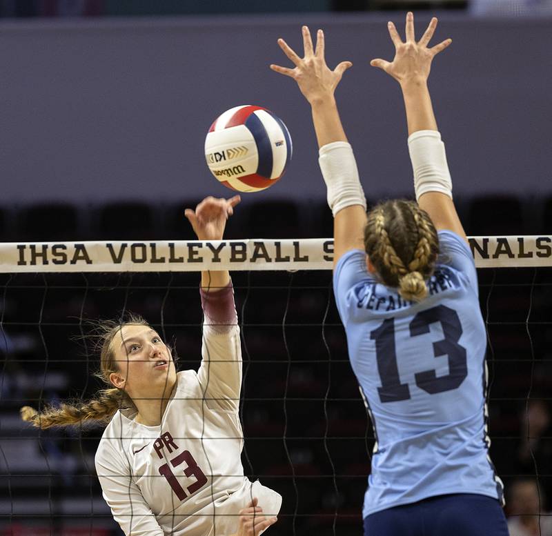Prairie Ridge's Abigail Smith hammers the ball against DePaul College Prep's Kalia Kroth Saturday, Nov. 16, 2024, in the Class 3A third place state volleyball match at CEFCU Arena in Normal.