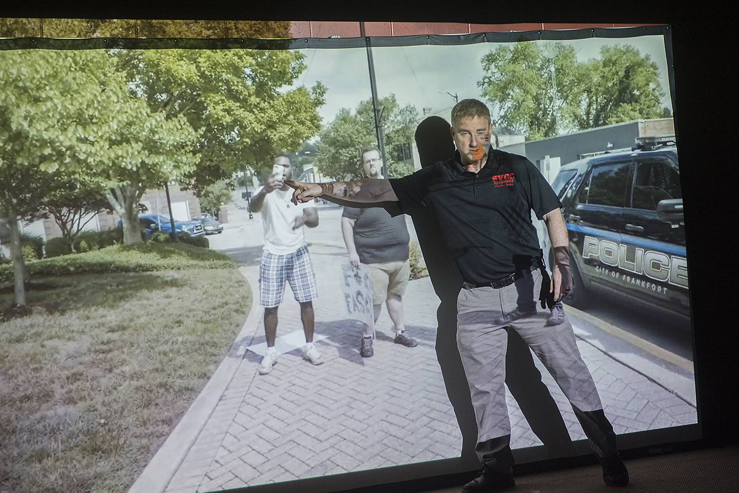 Steve Miko, criminal justice instructor at Sauk Valley College, runs through a scenario on a police simulator with his class Wednesday, March 2, 2022. There have been talks of a police academy being located at SVCC.