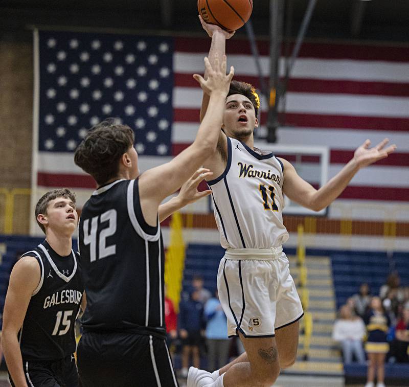Sterling’s Nico Battaglia puts up a shot over Galesburg’s Jaxon Wyatt Friday, Jan. 5, 2024 at Sterling High School.