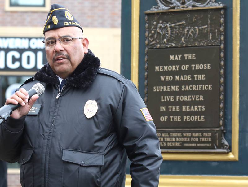 Manny Olade, Commander of DeKalb American Legion Post 66, speaks Thursday, Nov. 11, 2021, during a Veterans Day and Soldiers and Sailors Memorial Clock rededication ceremony at Memorial Park in downtown DeKalb.