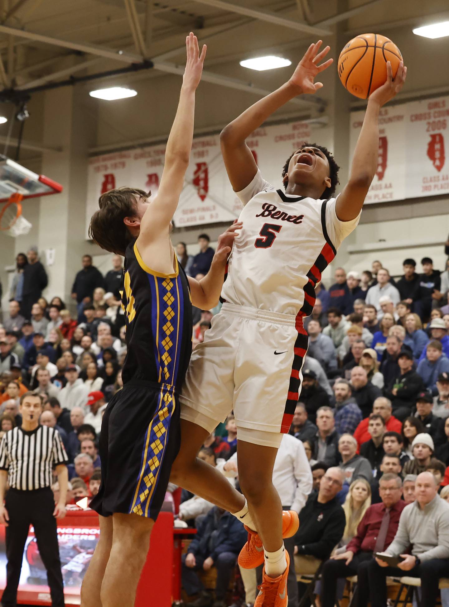 Benet's Perry Tchiegne (5) puts up a shot during the When Sides Collide Shootout basketball tournament between Benet Academy and Warren Township high schools on Saturday, Jan. 24, 2026 in Lisle, IL.