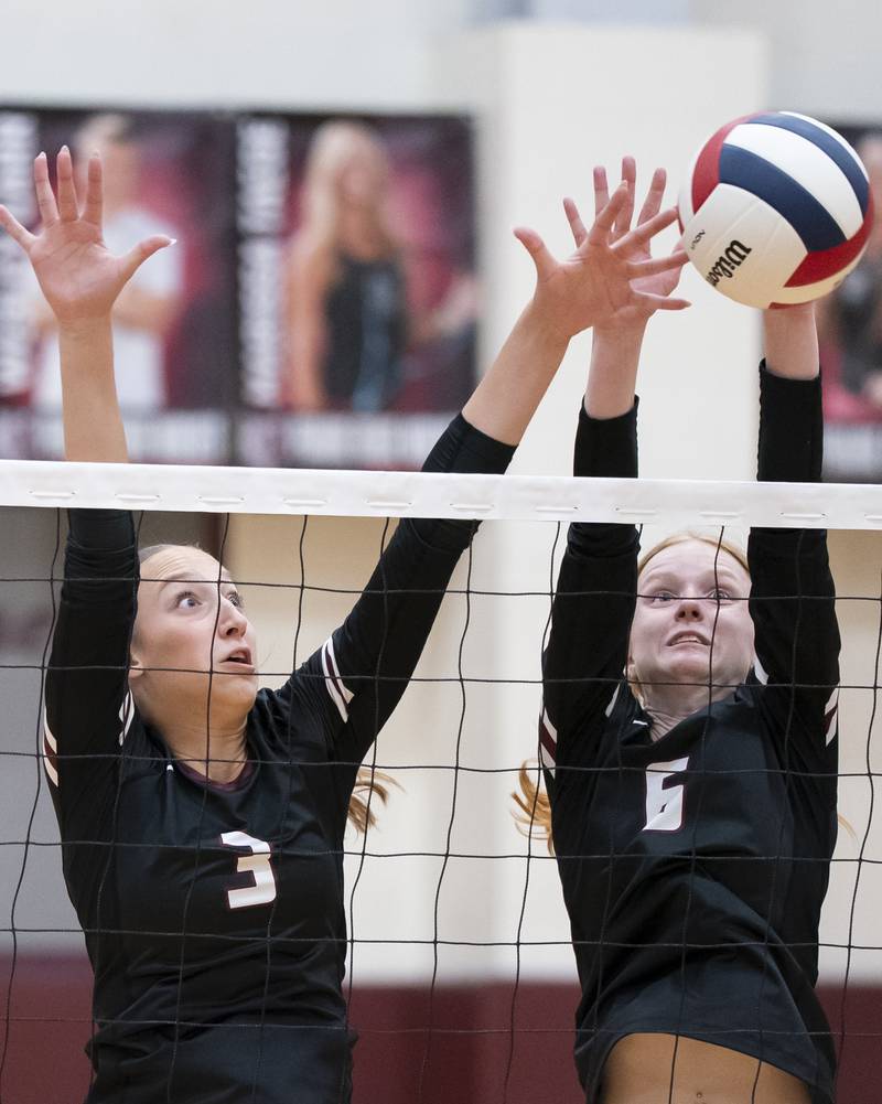 Prairie Ridge's Abby Smith, left, and Sonora Bekere, block a shot at the net during their game against Hampshire on Thursday, October 2, 2025 at Prairie Ridge High School in Crystal Lake. Ryan Rayburn for Shaw Local
