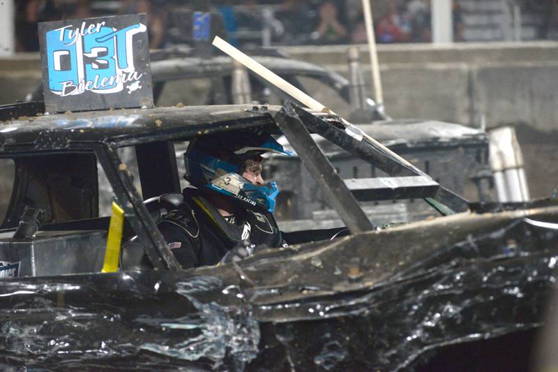 Tyler Bielema drives his car in the Open Wire heat at the Whiteside County Fair's demolition derby on Saturday, Aug. 17, 2024.
