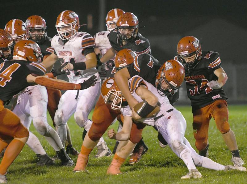 Fulton's Keegan VanKampen wraps up Forreston's Logan Dyson for a loss.