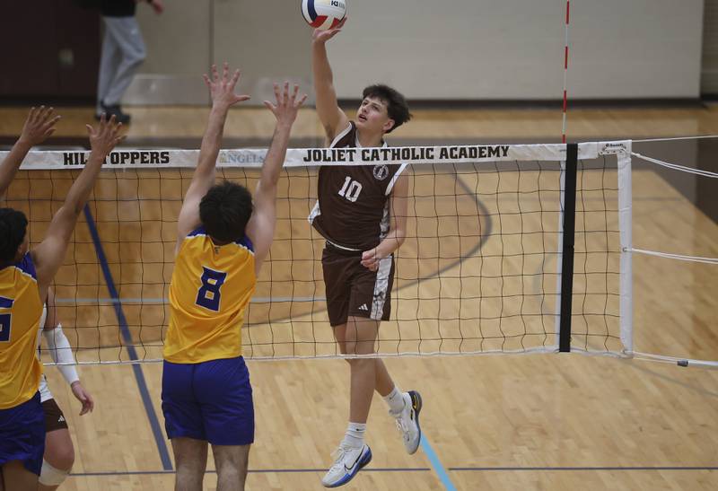Joliet Catholic’s Joseph Egizio hits a shot against Joliet Central on Wednesday, April 1, 2026 in Joliet.