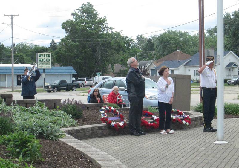 Plano American Legion member Dave Hulne (left) plays “Taps” in memory of the veterans who lost their lives at Plano's Memorial Day Ceremony that took place 10:30 a.m. May 27 at Veterans Walkway  and Little Rock Cemetery. Plano Mayor and Sons of the American Legion member Mike Rennels, Plano American Legion Auxiliary member Linda Hulne and Plano American Legion Post #395 Commander Gary Fruland laid wreaths in memory of veterans.