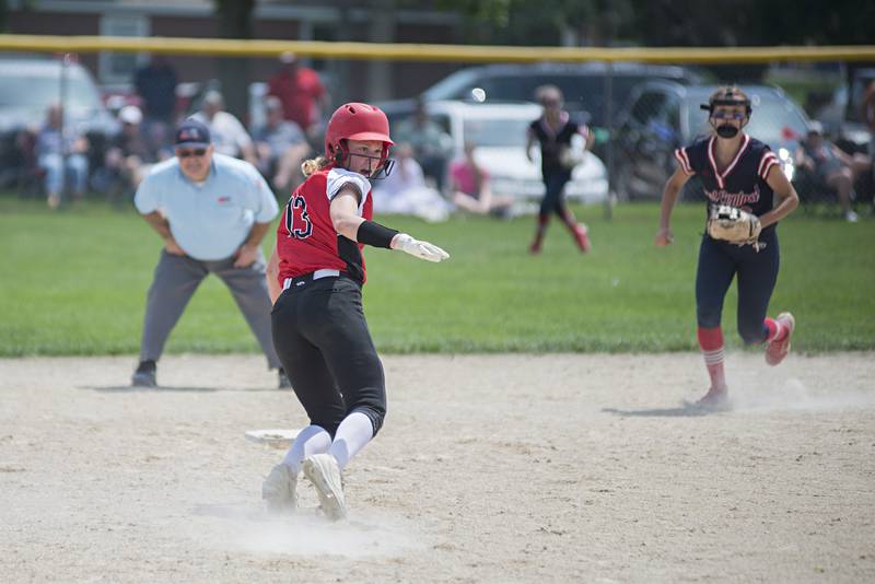 Forreston’s Kara Erdman scrambles back to second after a caught line drive against West Central Monday, May 30, 2022.