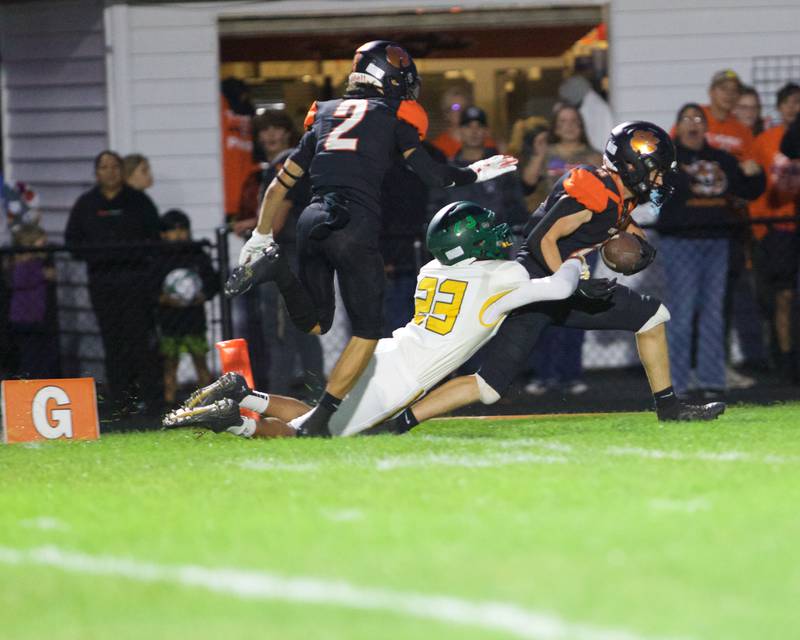 Crystal Lake Central's Carter Kelly scores a touchdown  against Crystal Lake  South's Noa Franch could not stop the touchdown on Friday, Sept. 27,2024 in Crystal Lake.