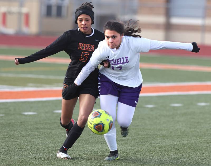 DeKalb's Madison McNeil and Rochelle's Kara Martinez go after the ball during their game Thursday, April 14, 2022, at DeKalb High School.