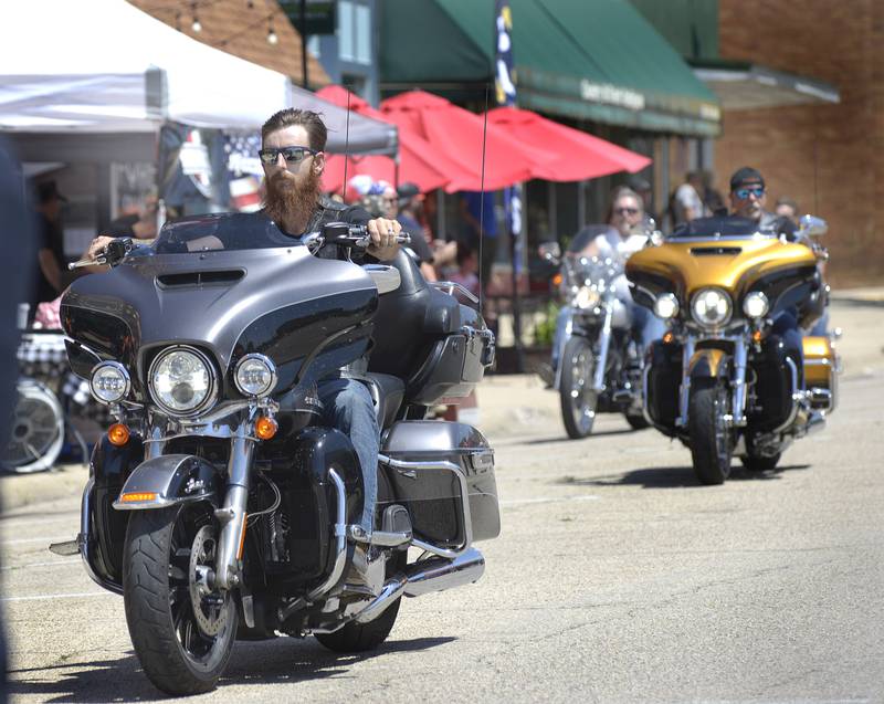 Motorcycle riders head down Main St as they enter downtown Marseilles Saturday during the Annual Illinois Motorcycle Freedom Run.