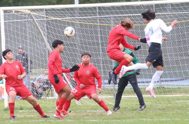 Kankakee's Alexis Cruz (right) puts the ball in the box against L-P defenders during the Class 2A Regional title game on Saturday, Oct. 25, 2025 at Ottawa High School.