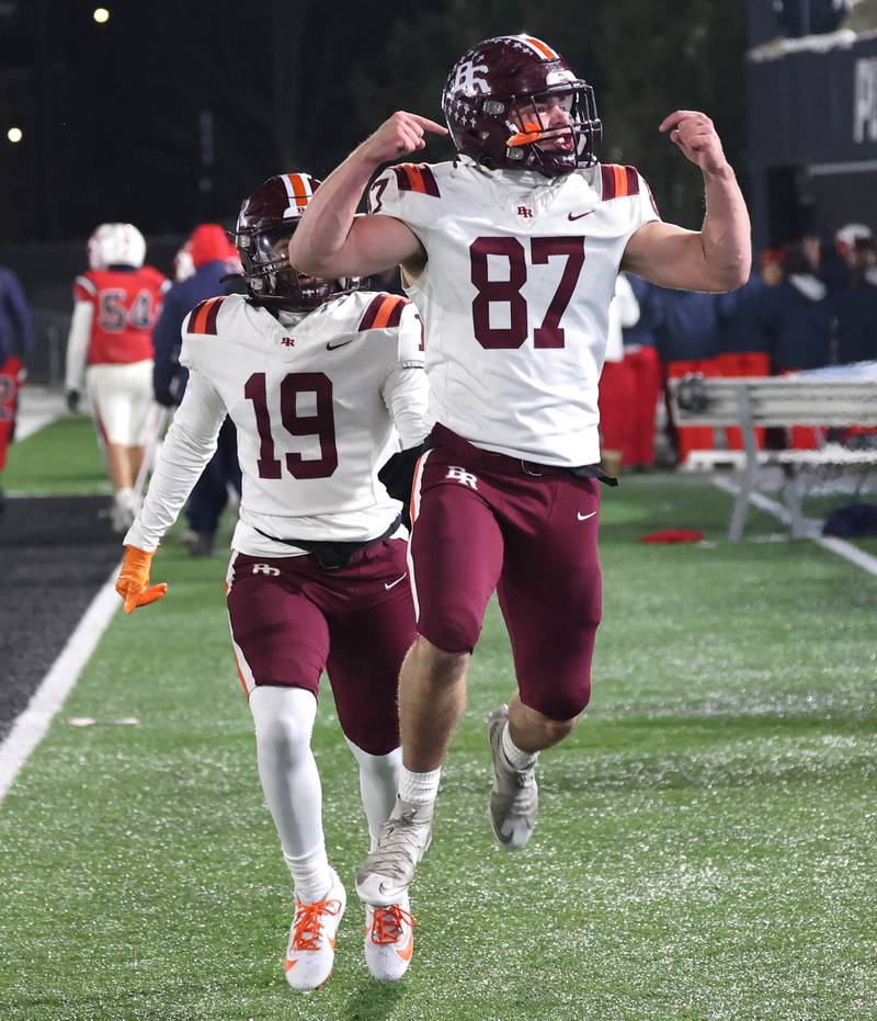 Brother Rice players celebrate Wednesday, Dec. 3, 2025, after their IHSA Class 7A state chamionship win over St. Rita in Huskie Stadium at Northern Illinois University in DeKalb.