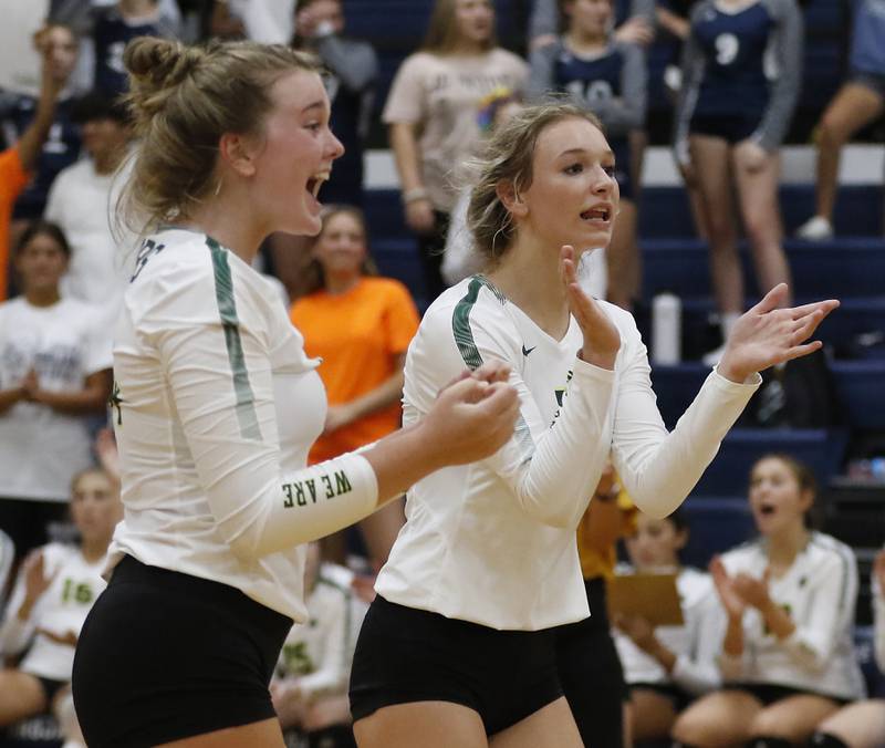 Crystal Lake South’s Emma Stowasser and Gabby Wire  celebrate a point during a Fox Valley Conference volleyball match Thursday, Aug. 25, 2022, between Cary-Grove and Crystal Lake South at Cary-Grove High School.